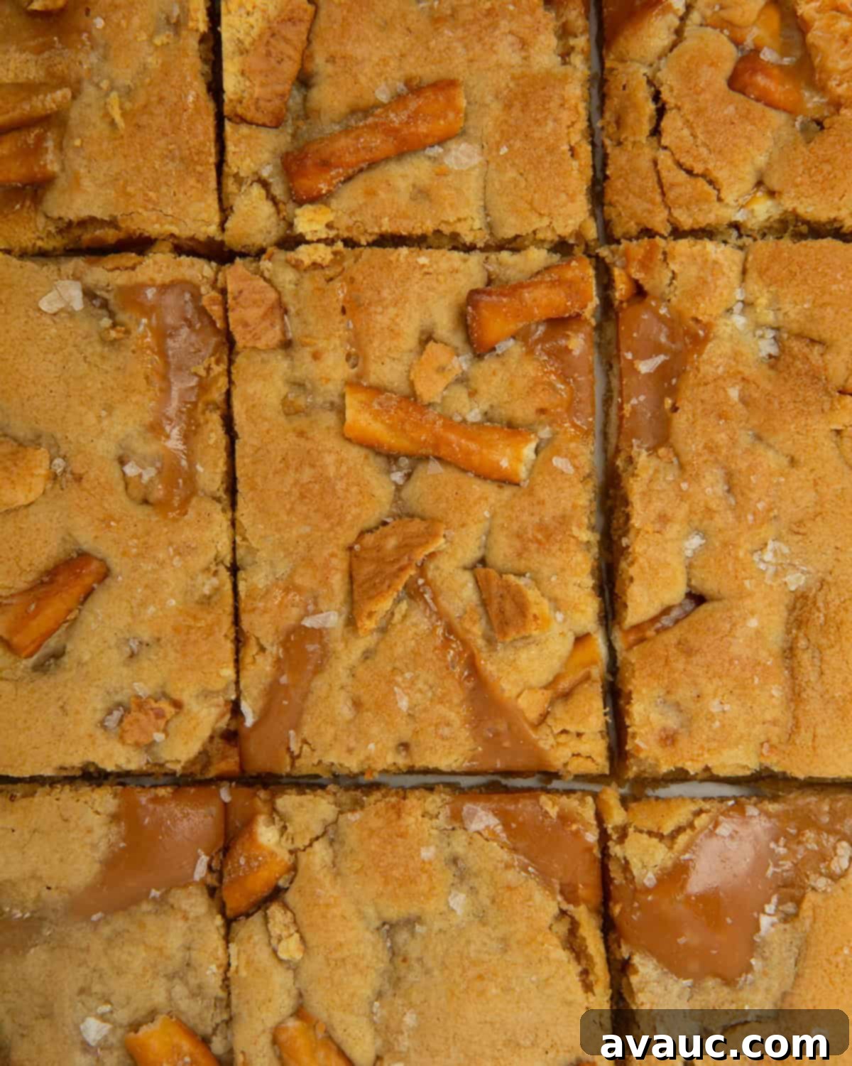 caramel apple kitchen sink cookie bars cut into rectangles and arranged on a serving plate
