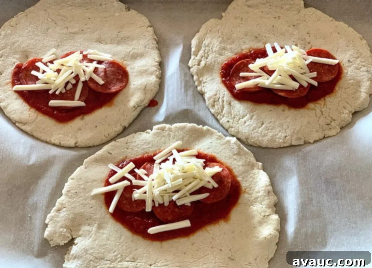 Crafting Your Own Calzone Delights 7 Open calzones revealing melted dairy-free cheese and pizza sauce, fresh from the oven.
