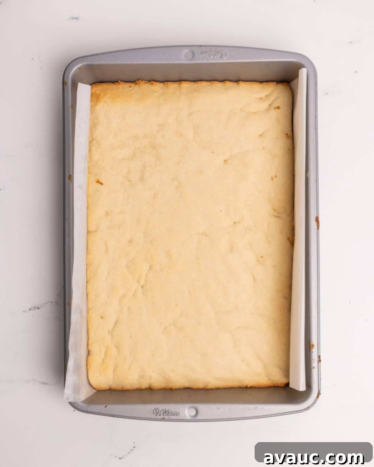 Festive Santa Hat Cookie Bars 5 baked sugar cookie bar recipe in 9x13 metal pan