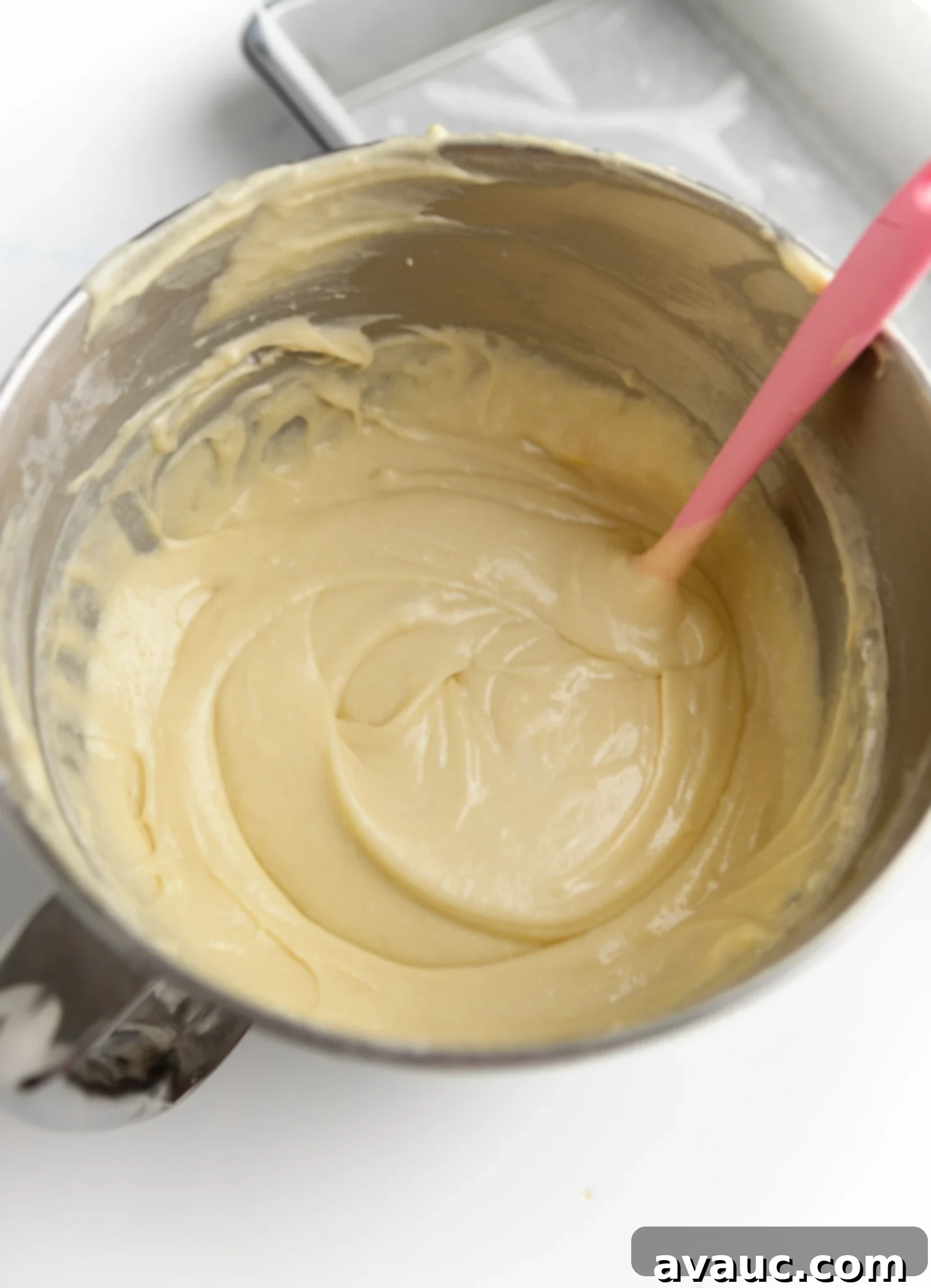 Bowl of smooth white chantilly cake batter, ready for baking