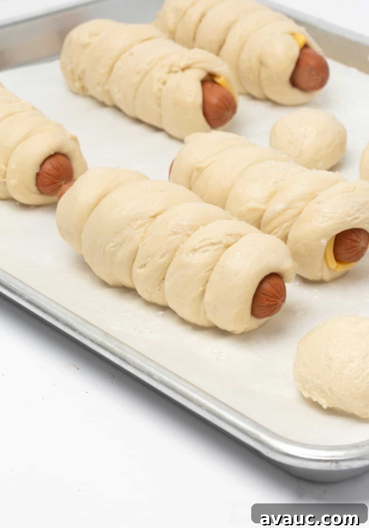 Pretzel Hot Dogs in a Flash 12 Unbaked soft pretzel dough wrapped around a hot dog, ready for the oven.
