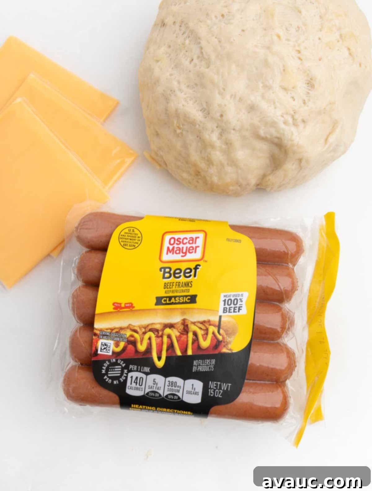 Pretzel Hot Dogs in a Flash 4 A collection of ingredients for making pretzel hot dogs, including flour, yeast, butter, hot dogs, and cheese.