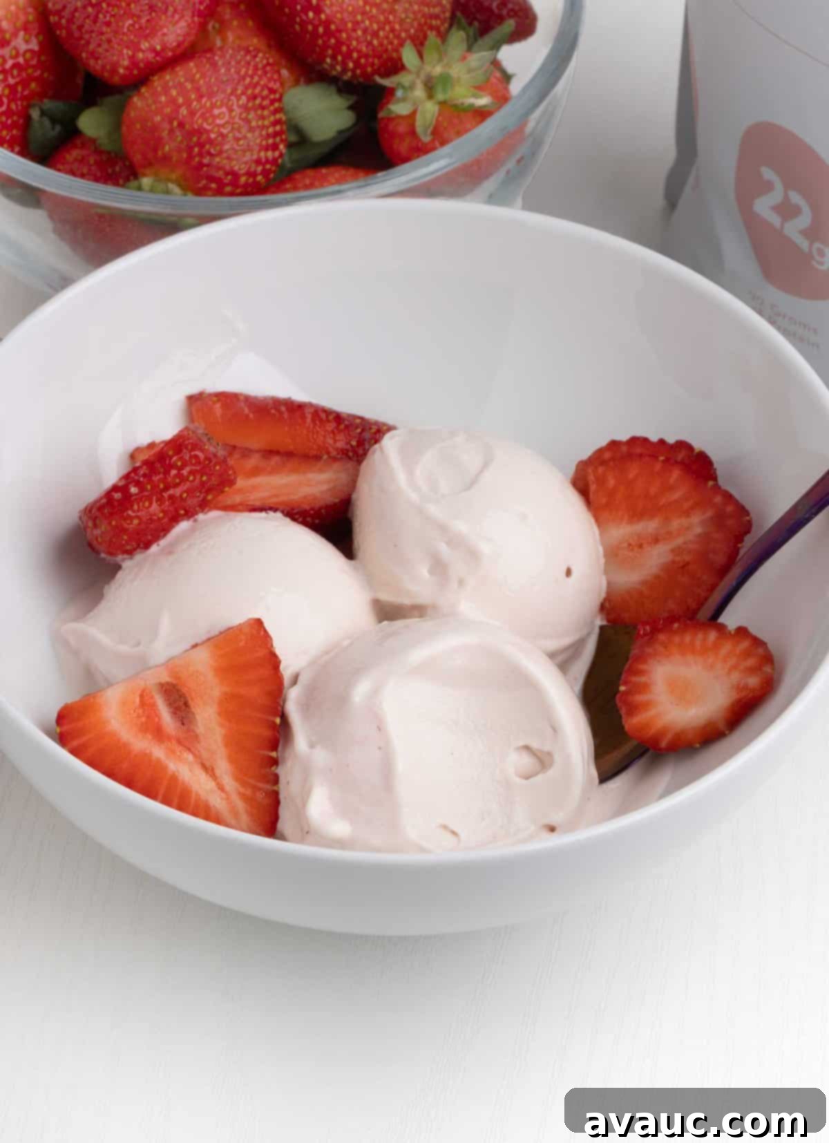 Ninja Creami Strawberry Protein Frozen Yogurt 8 Scoops of finished Ninja Creami strawberry frozen yogurt topped with fresh berries