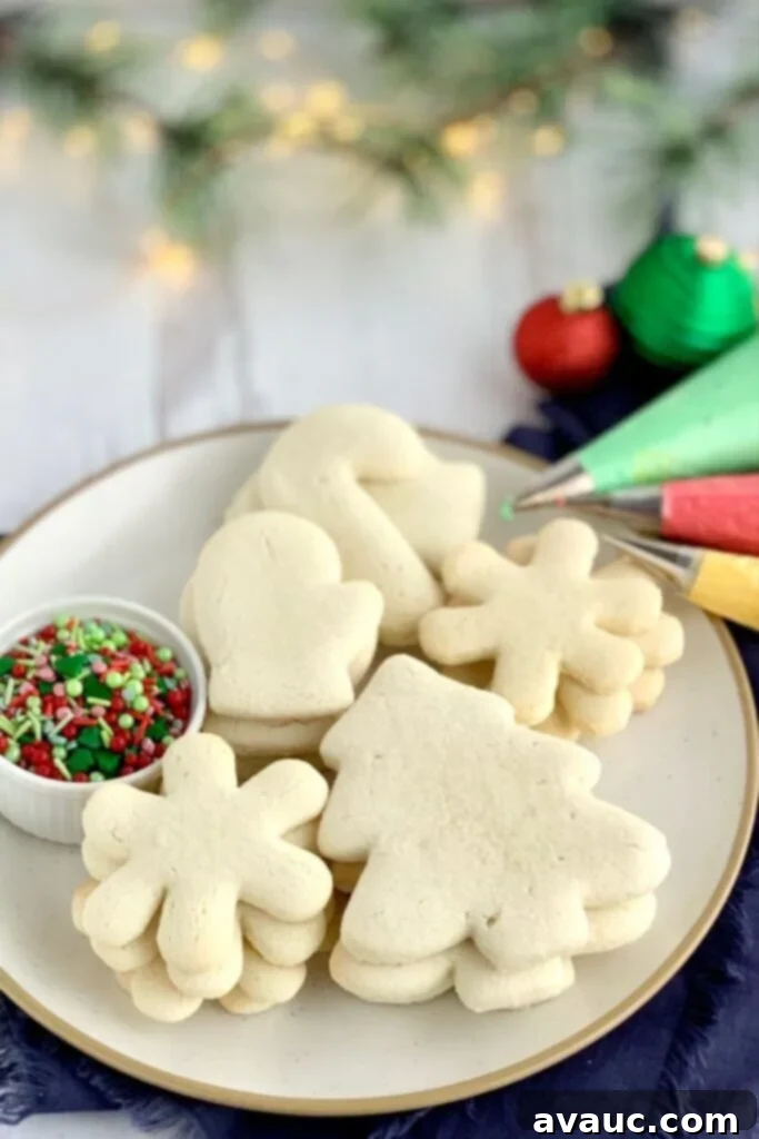 Deliciously Soft Gluten and Dairy Free Sugar Cookies 3 A pile of Gluten Free Sugar Cookies with sprinkles on a plate.