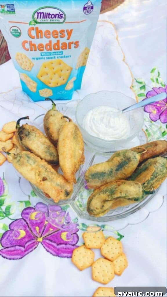 Double Cheese Chiles Capeados - A delicious Mexican appetizer with cheesy filling and crunchy cracker coating, perfect for parties and gatherings.