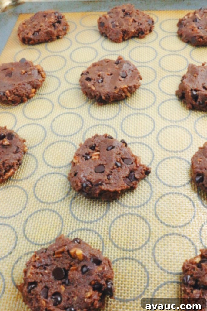 Flattening double chocolate almond flour cookies with fingers for a desired shape #cookies #almondflourcookies