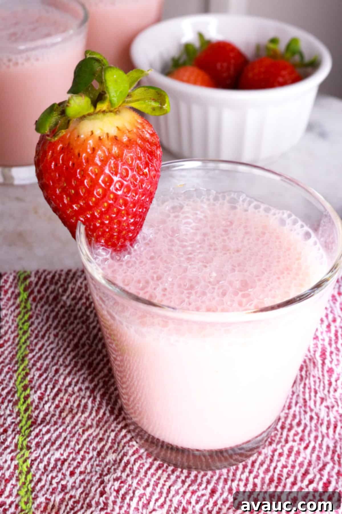 Blissful Strawberry Fresca 2 Creamy Strawberry Agua Fresca in a glass with a strawberry garnish