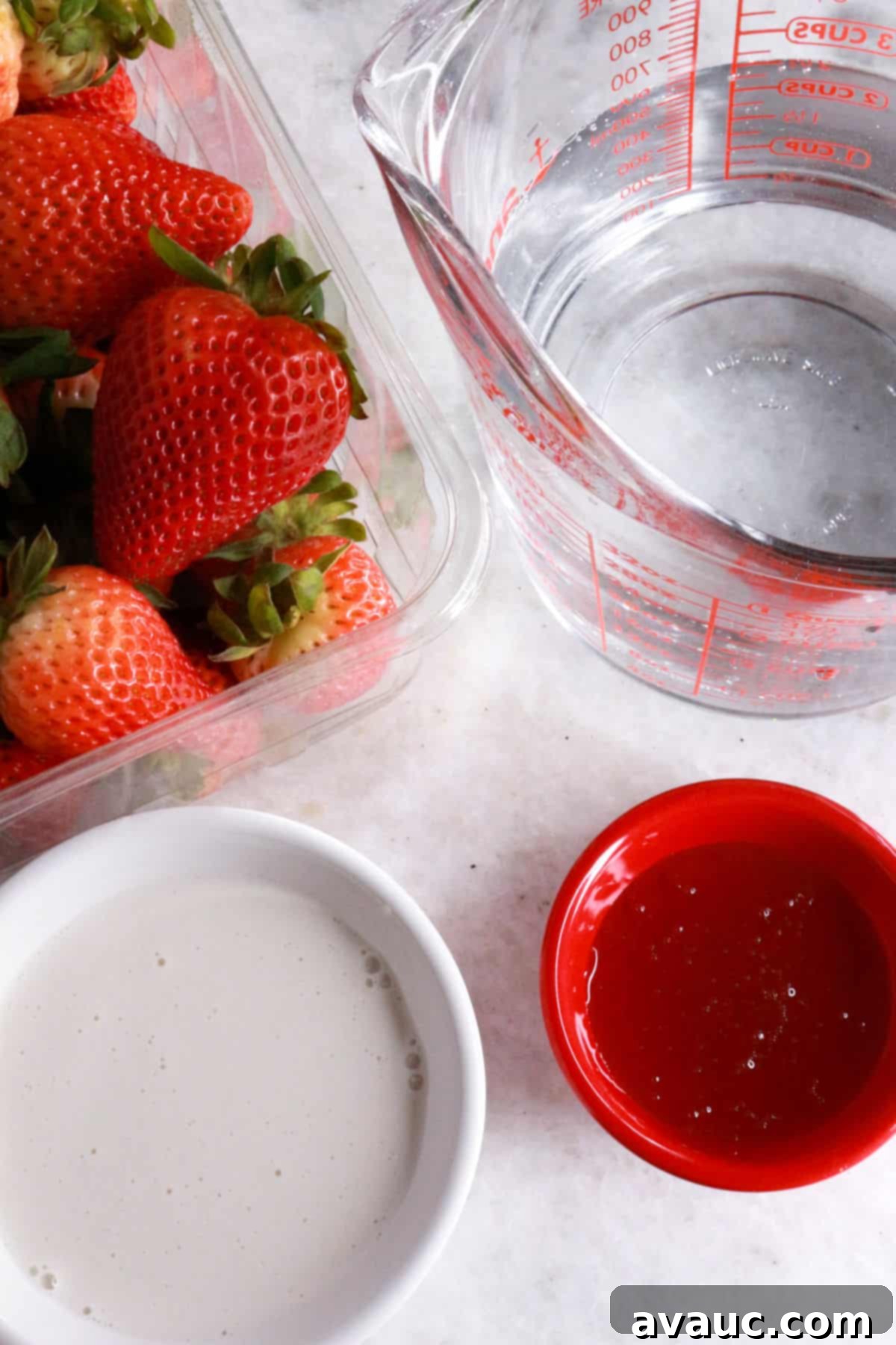 Blissful Strawberry Fresca 3 Container with strawberries, measuring cup with water, bowl with creamer, bowl with honey