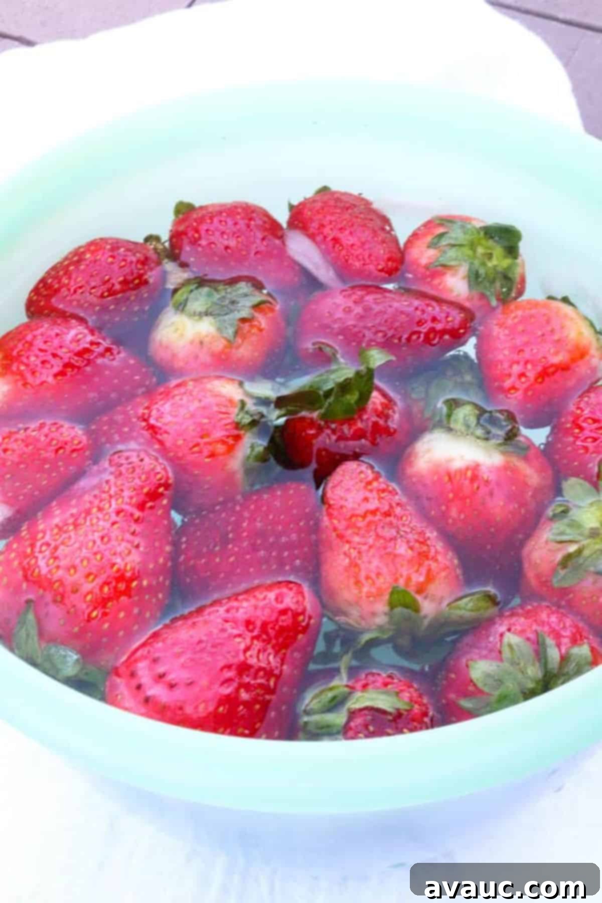 Blissful Strawberry Fresca 4 Bowl with water and strawberries