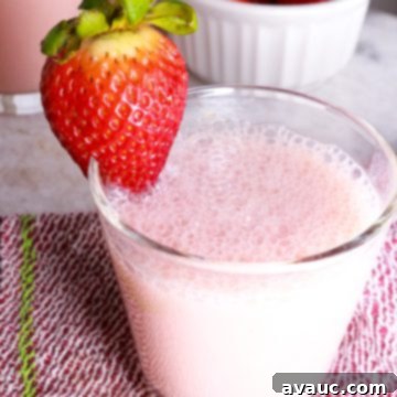 Blissful Strawberry Fresca 8 Creamy Strawberry Agua Fresca in a glass with a strawberry garnish