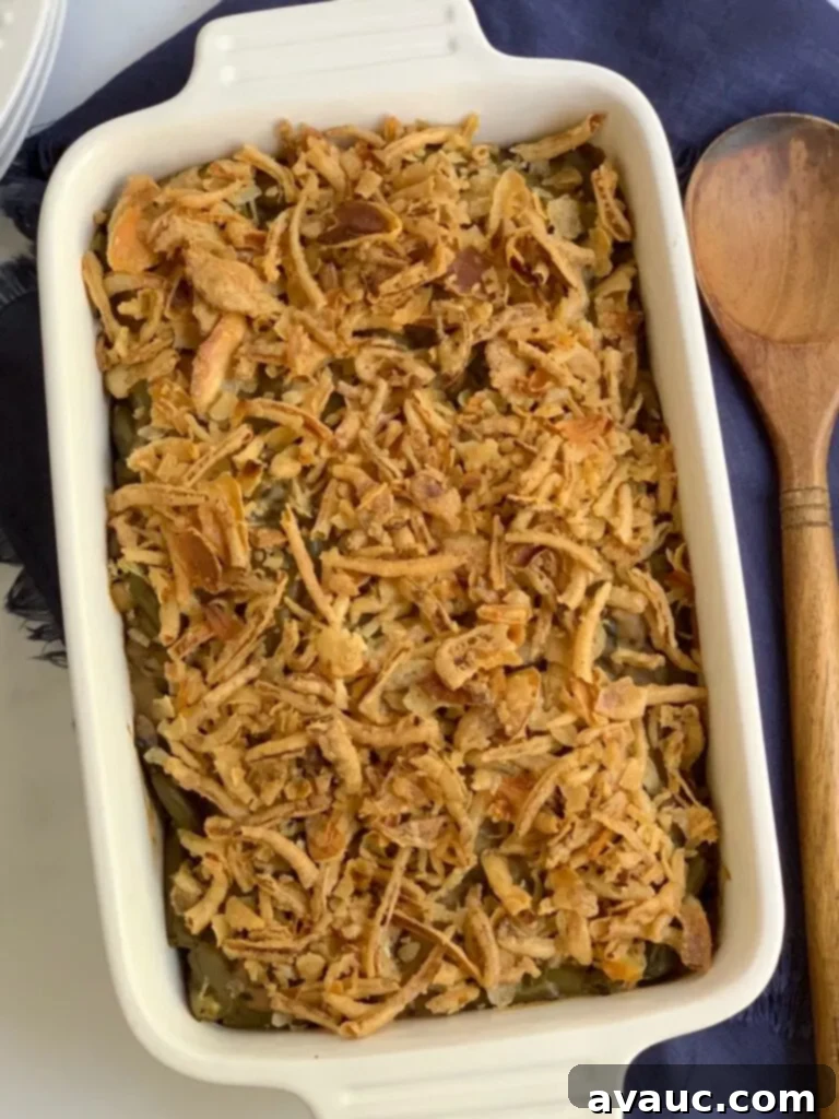 a large baking dish with creamy homemade mushroom soup with tender green beans, topped with crispy French onions.