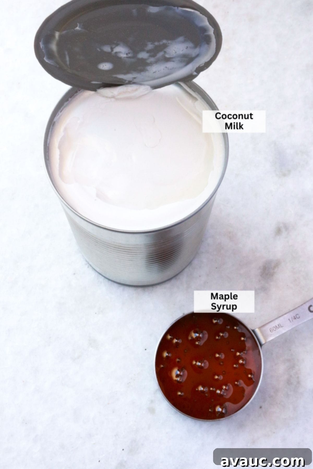 Homemade Coconut Condensed Milk 3 A can of coconut milk and a spoonful of maple syrup to make coconut condensed milk