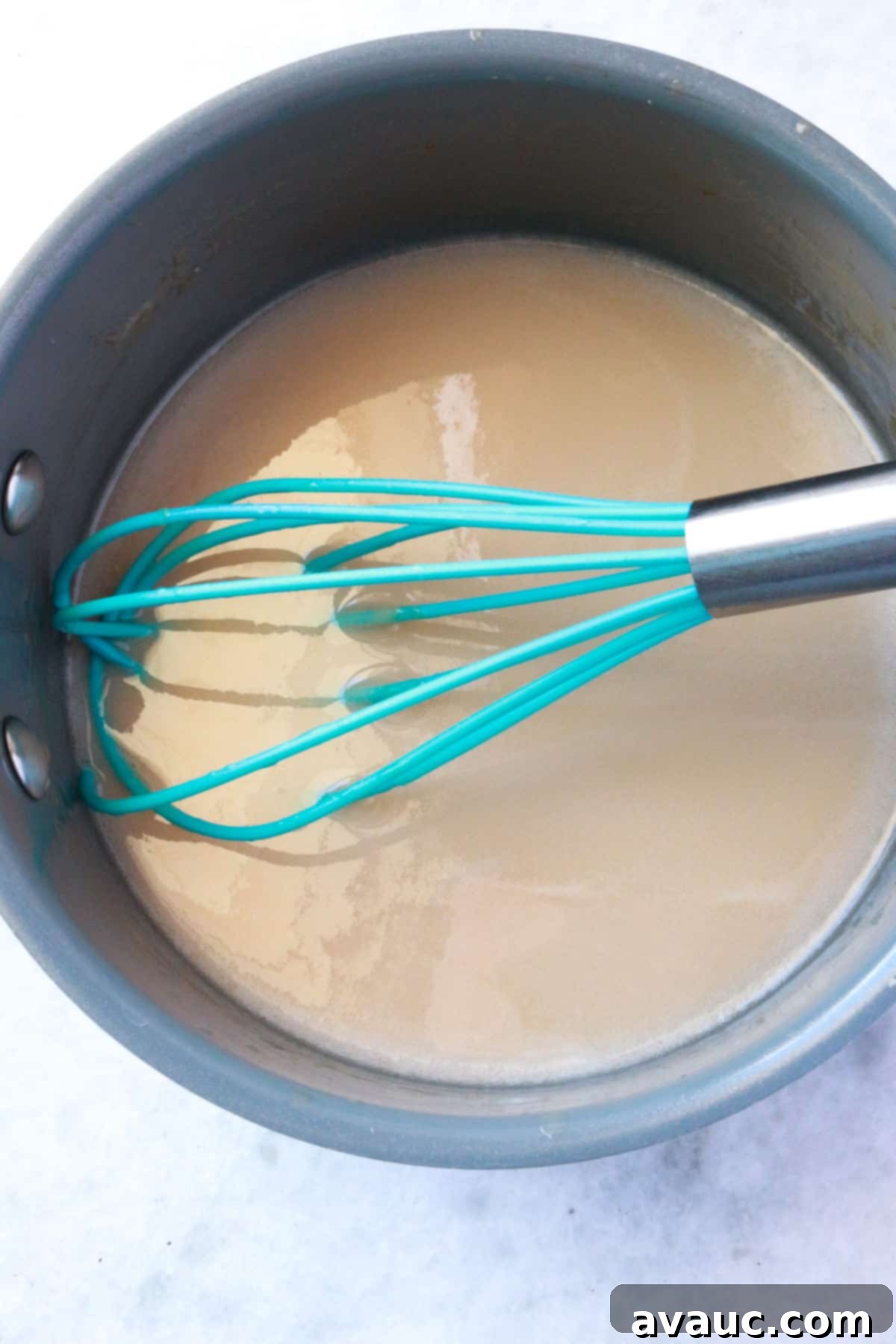 Homemade Coconut Condensed Milk 7 A small pot of simmering condensed coconut milk