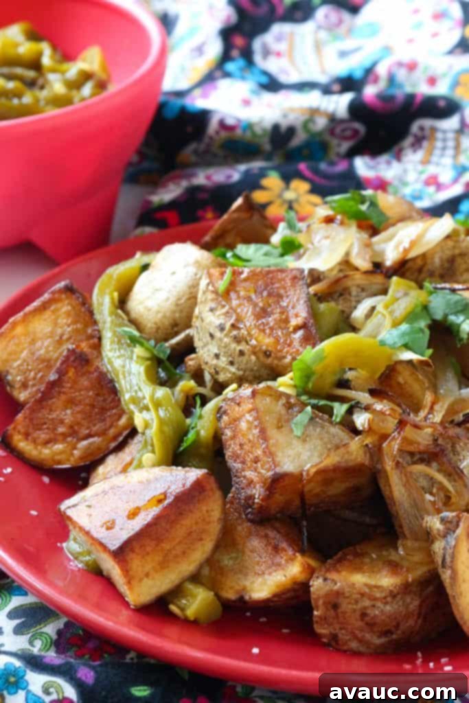 Smoky Grilled Peppers and Potatoes 2 Grilled Rajas con Papas, a flavorful Mexican side dish with smoky roasted green chiles, grilled onions, and crispy potatoes.