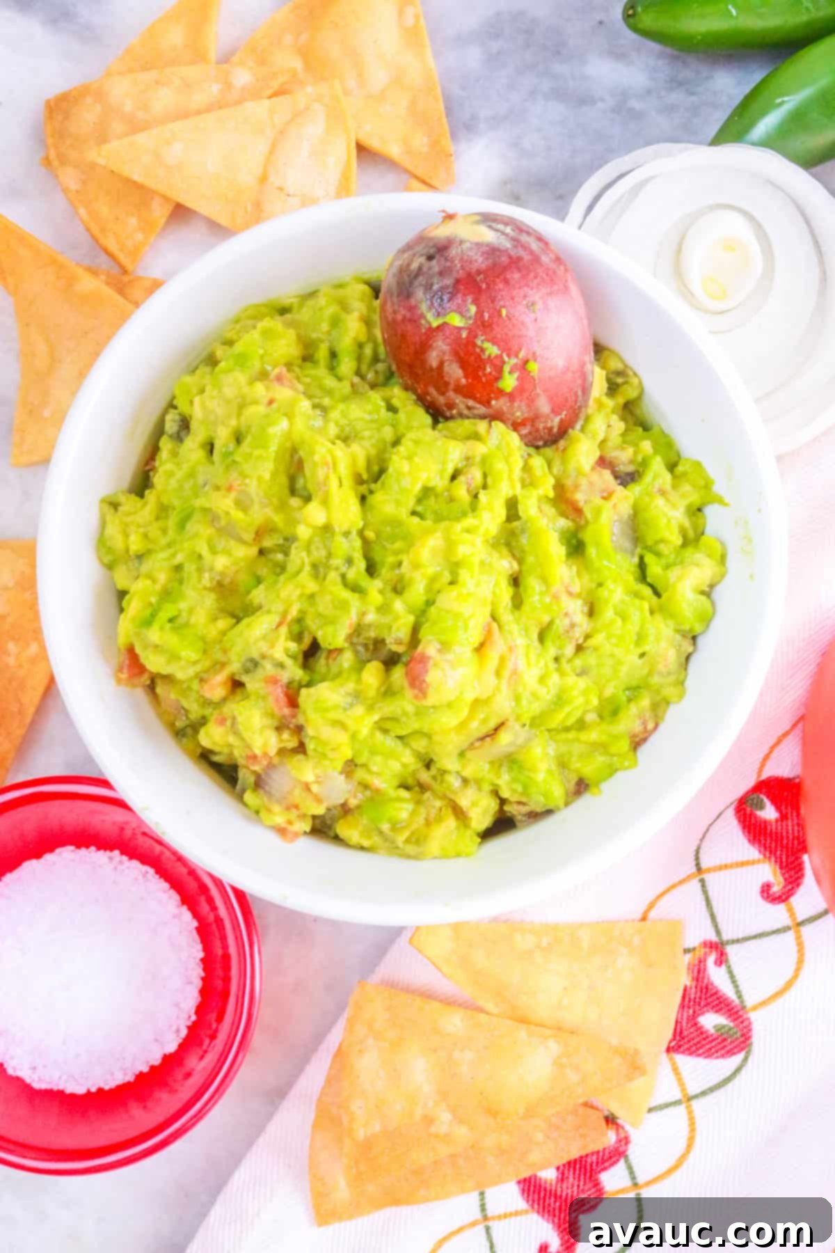 Smoky Simplicity Guacamole with Only Four Ingredients 2 Fire Roasted Guacamole surrounded by tortilla chips and vegetables