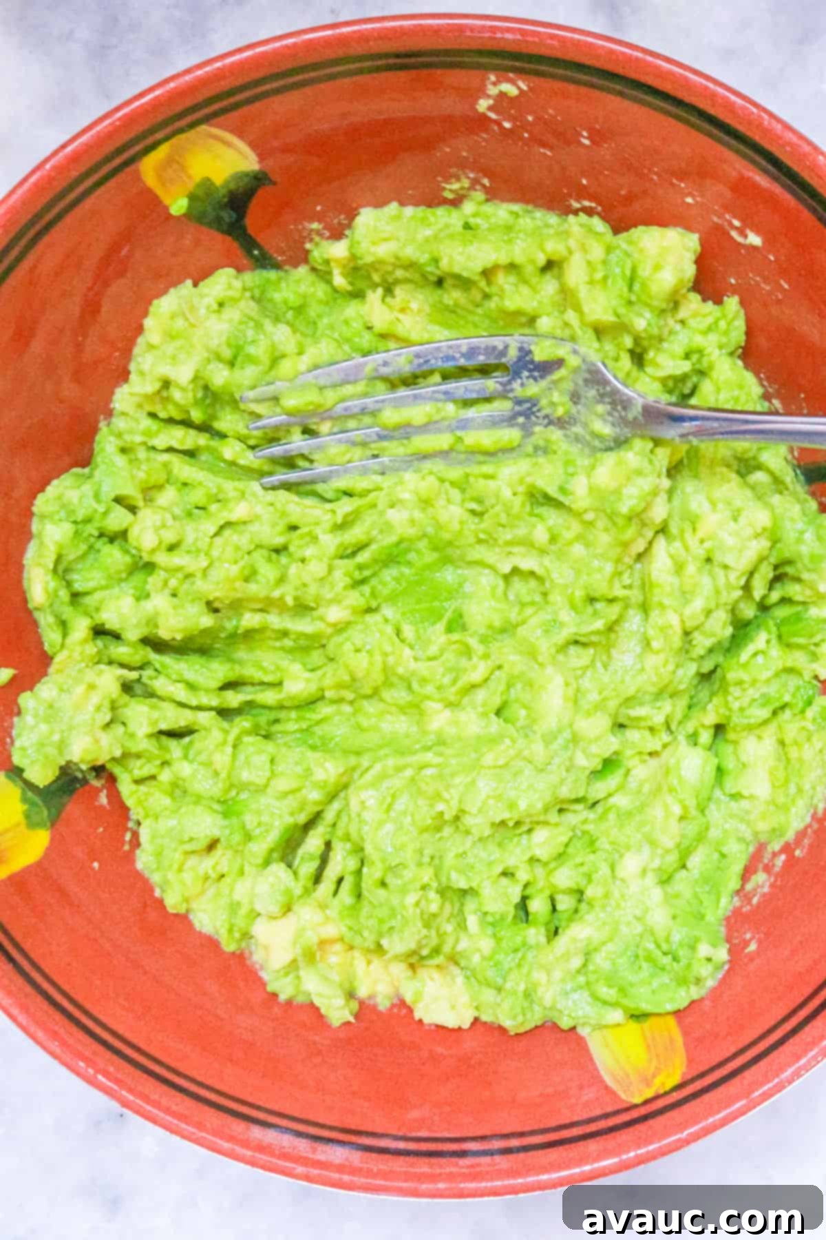 Smoky Simplicity Guacamole with Only Four Ingredients 7 Mashed avocado in a bowl