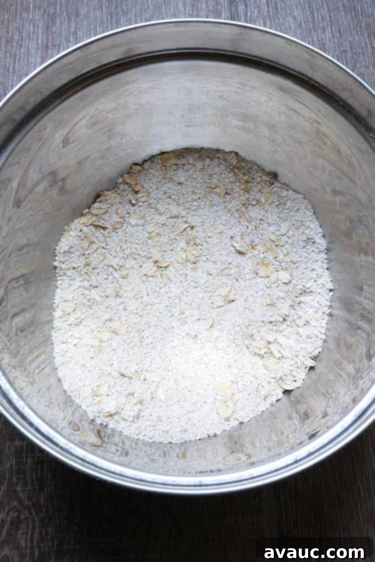 Soft Chewy Vegan Oatmeal Chocolate Chip Cookies 4 Oat flour in a metal bowl, ready for mixing