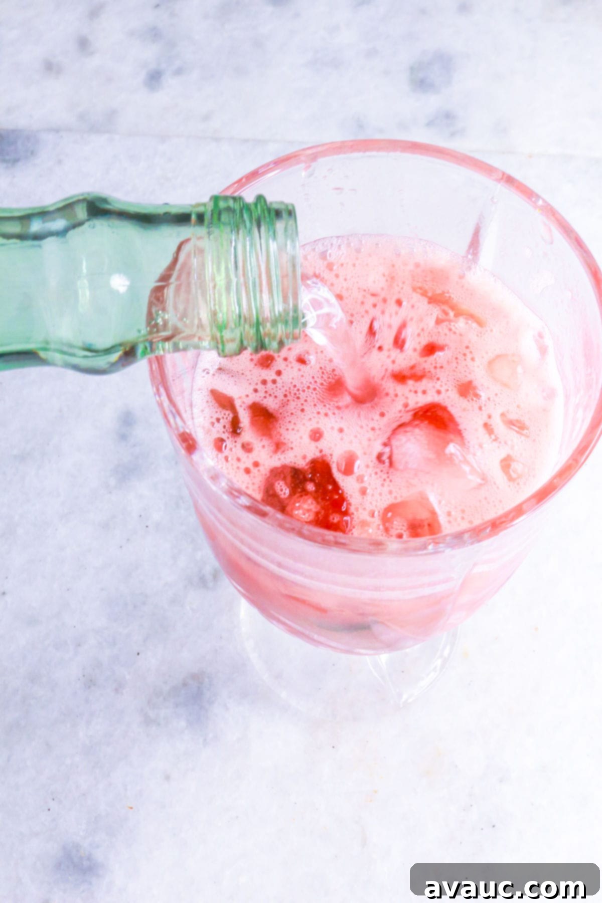 Adding sparkling water to watermelon juice