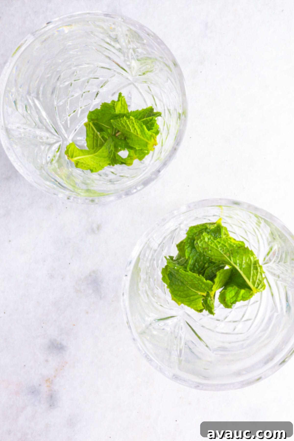 Muddled mint in glasses