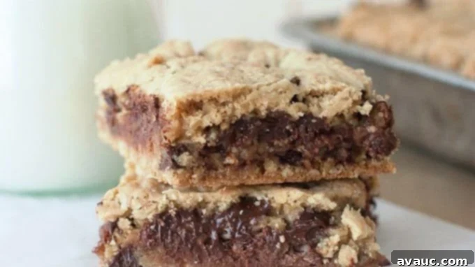 Close-up of a cut Chocolate Caramel Layered Revel Bar showing the gooey center