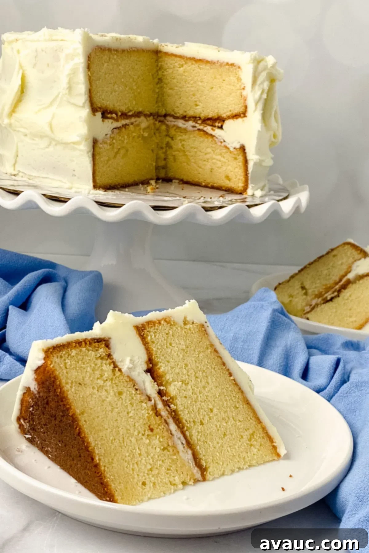 A tantalizing slice of gluten-free eggnog cake, beautifully frosted and ready to be enjoyed during the holiday season.