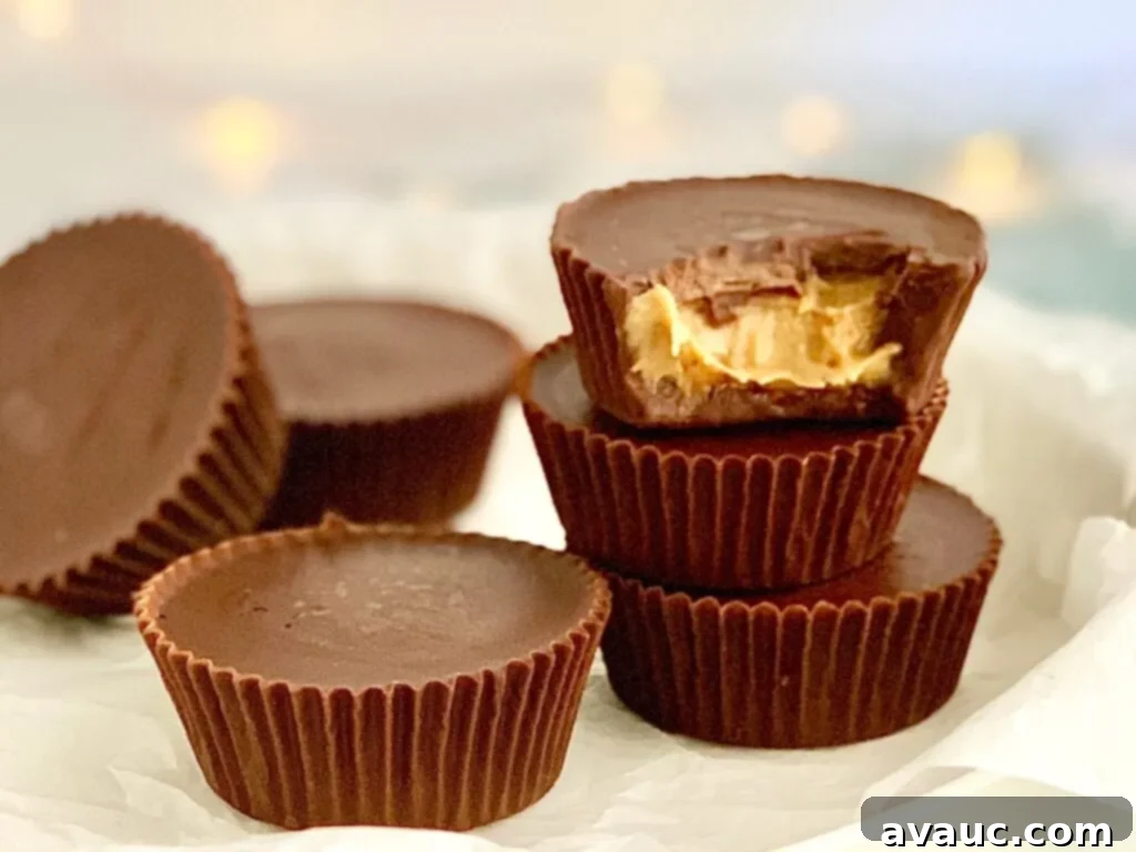 A tempting stack of perfectly crafted homemade peanut butter cups, showcasing their rich chocolate exterior and creamy peanut butter filling.