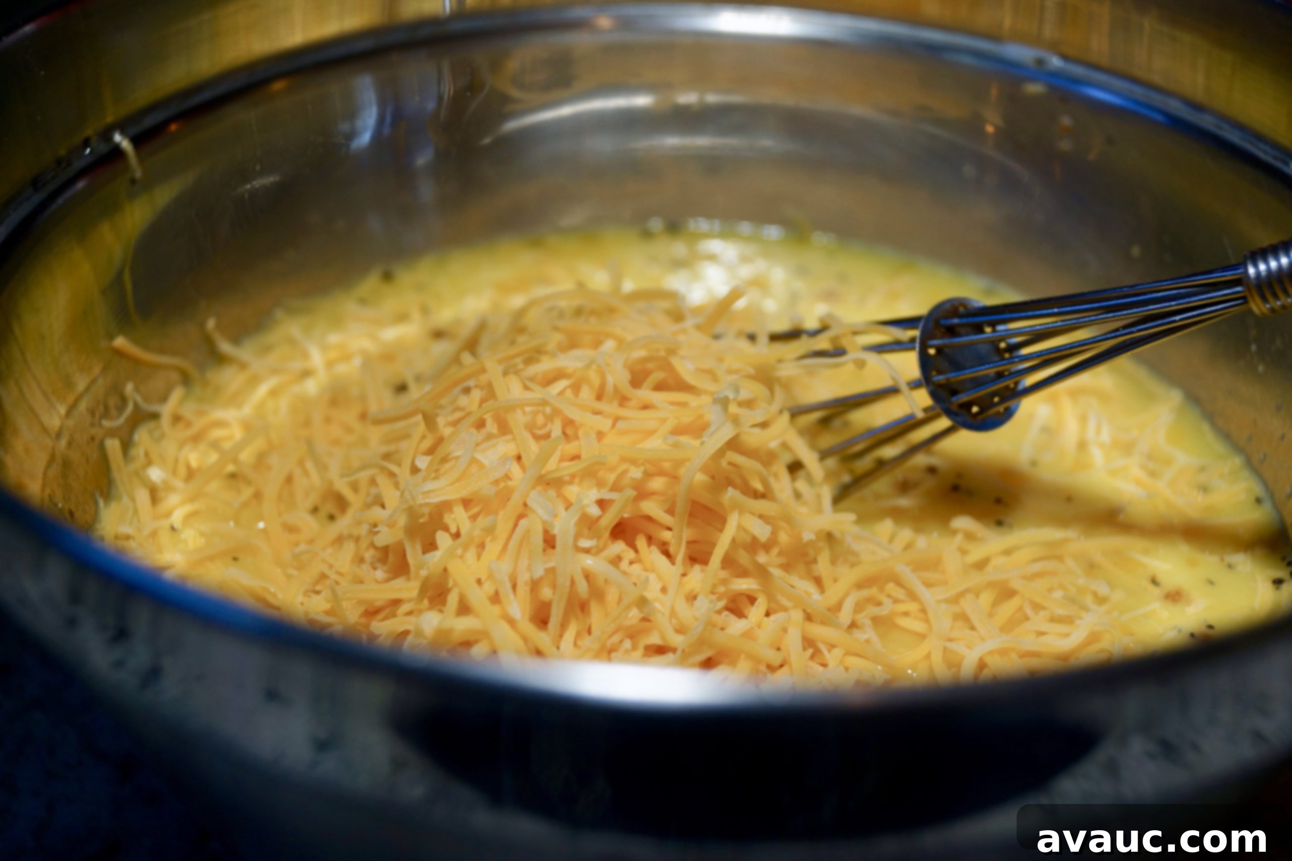 Whisked egg mixture in a bowl, before adding other ingredients
