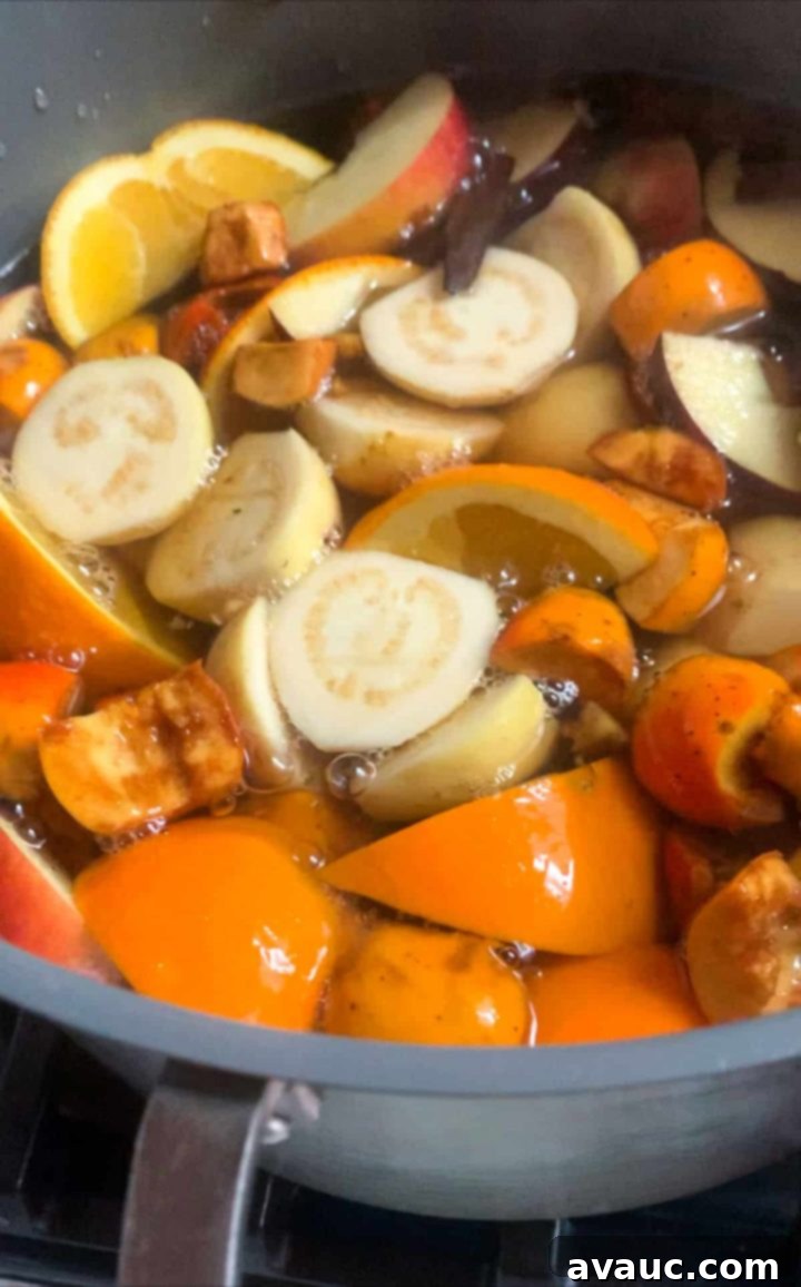 Pot of boiling fruit for ponche navideño