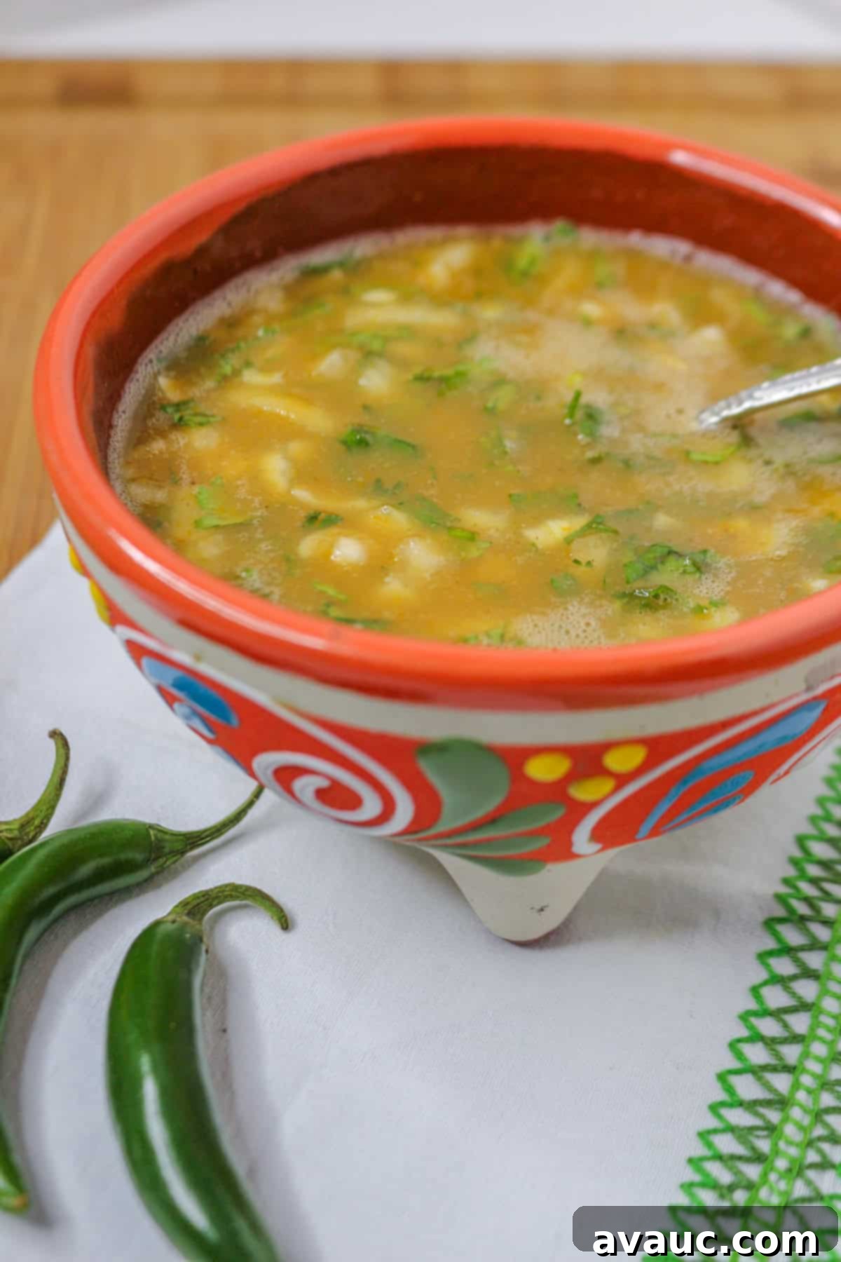Bowl of homemade serrano salsa on a white cloth