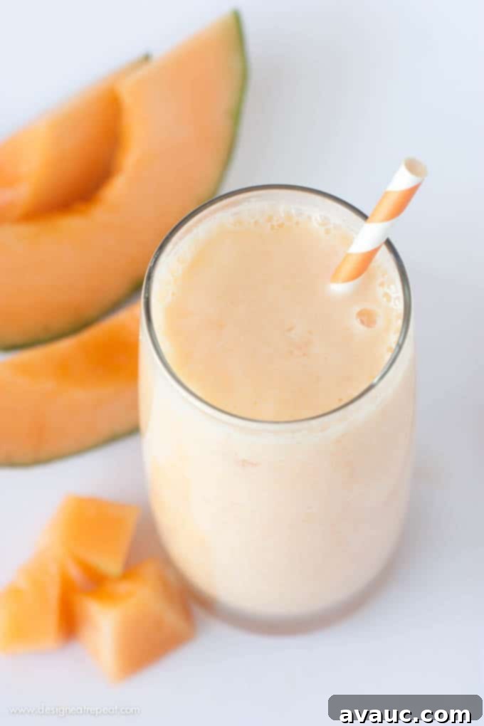 Close-up of a glass of Peach Cantaloupe Smoothie, showcasing its vibrant color and refreshing texture