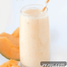 Refreshing Peach Cantaloupe Smoothie for One 4 Vibrant Peach Cantaloupe Smoothie in a glass, ready to be enjoyed.