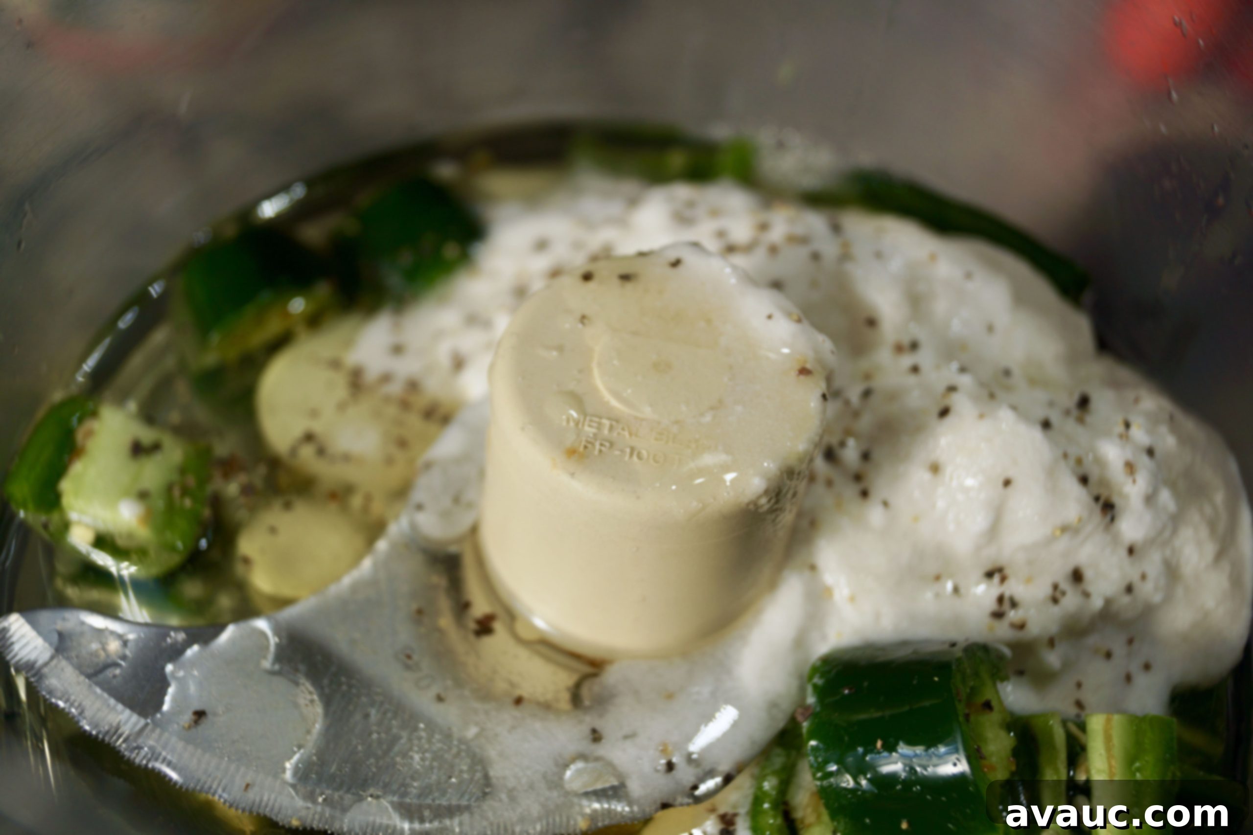 Blending Coconut Lime Jalapeño Dressing in a food processor