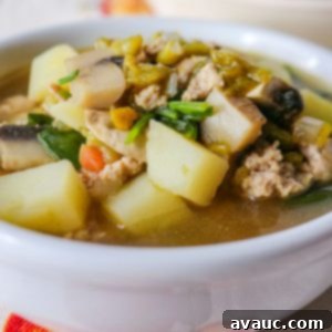 A bowl of roasted green chile turkey soup, ready to be served