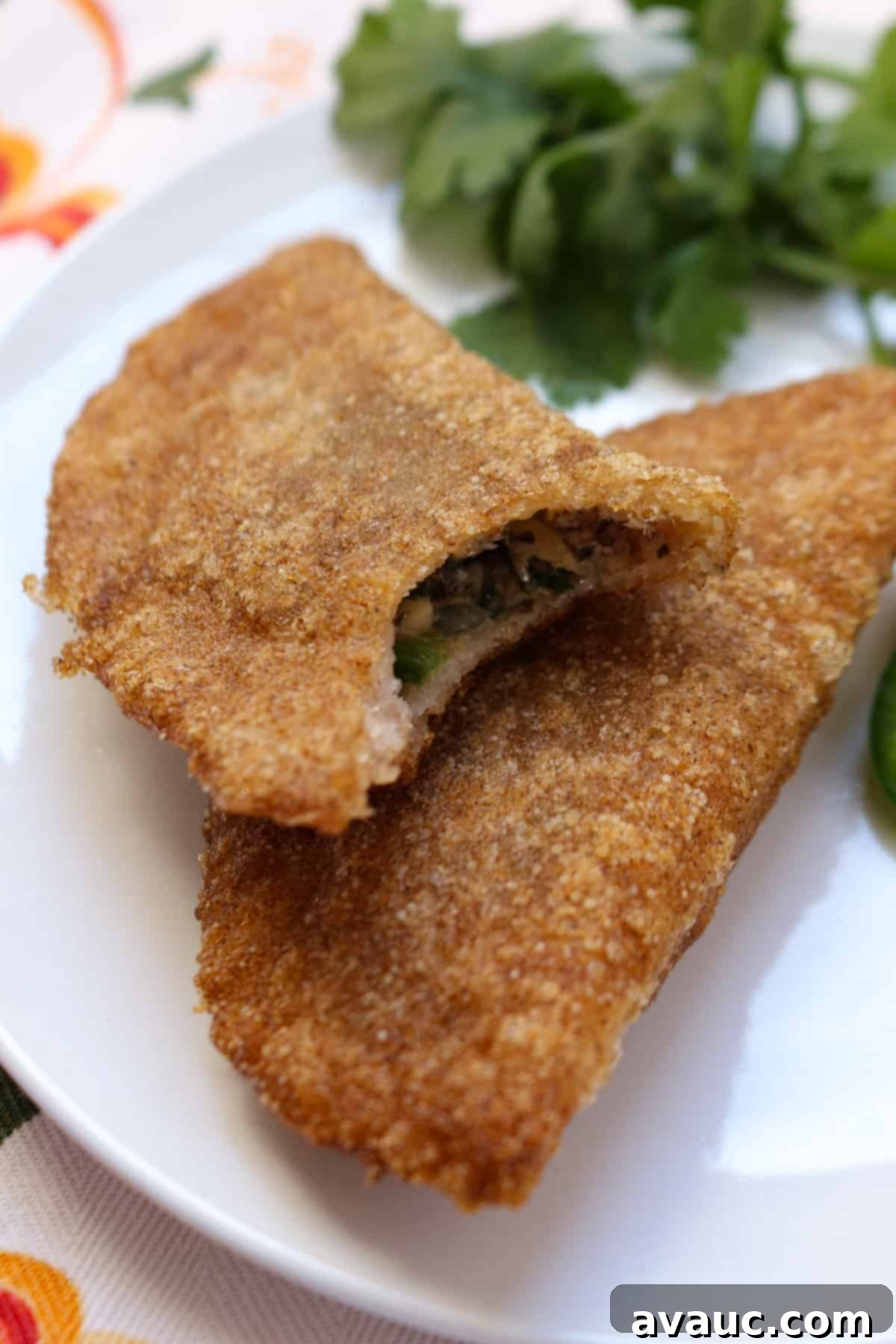 Savory Gluten-Free Sardine Empanadas 10 Two gluten-free sardine empanadas on a plate