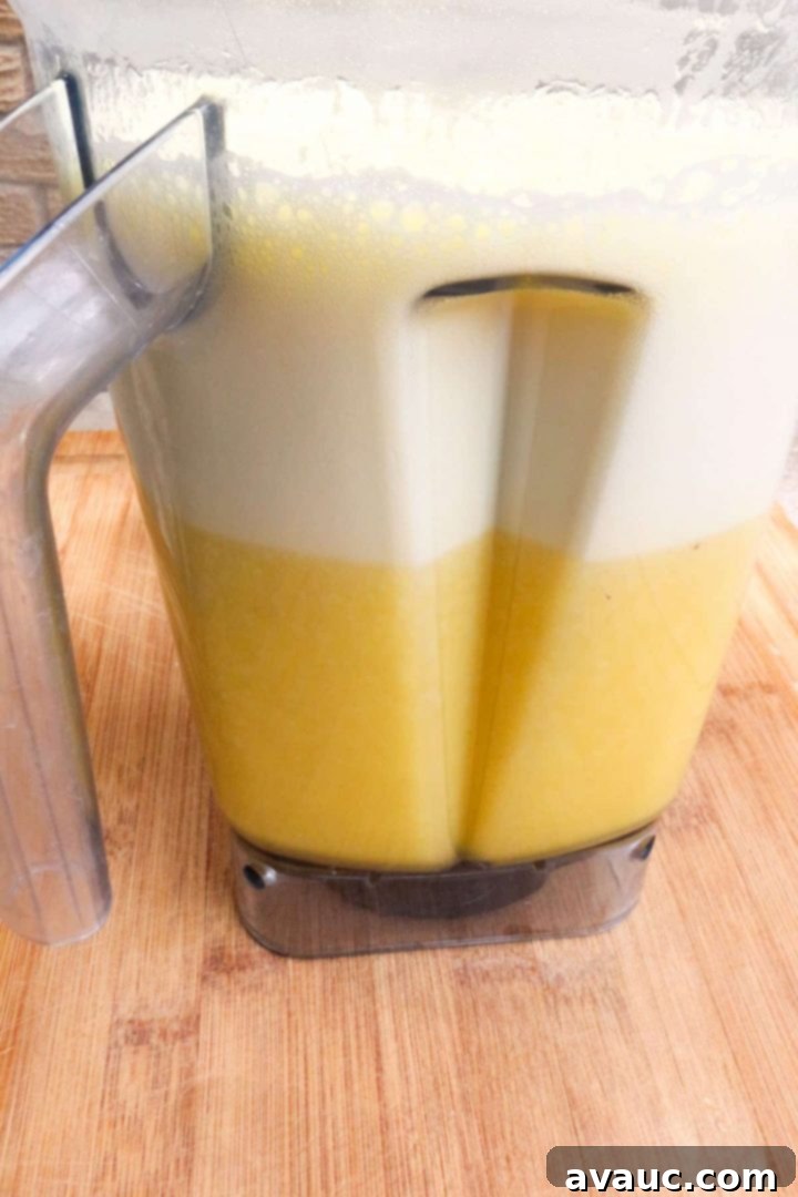 Fresh Pineapple Cooler 6 Step 3: The pineapple and water are blended until smooth and frothy.