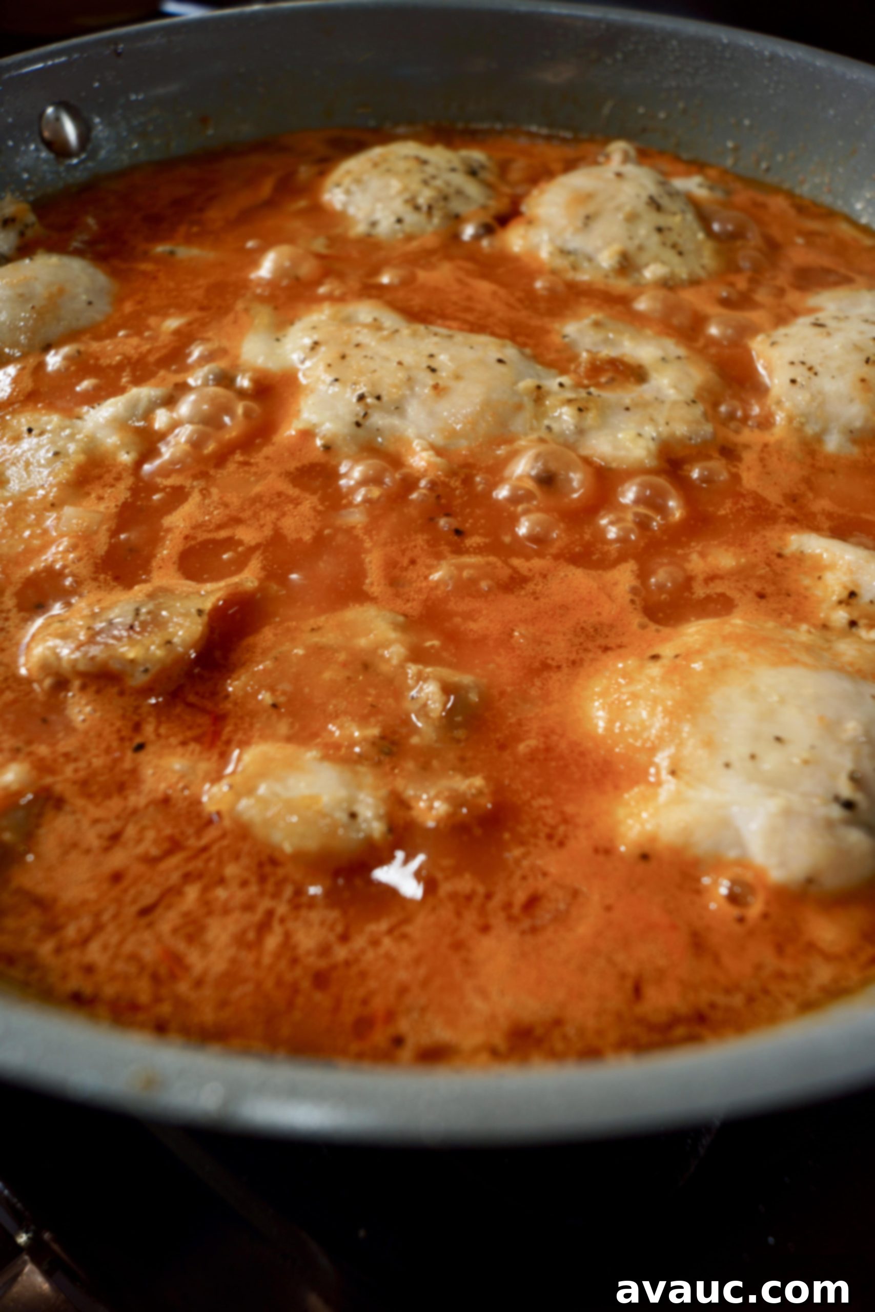 Cauliflower Mexican Arroz con Pollo 6 Tender chicken simmering in sauce for Mexican cauliflower arroz con pollo