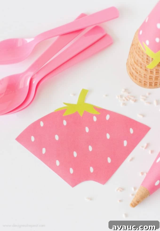 Sweet Strawberry Printable Cone Wraps 4 Step 1: Cutting out the free printable strawberry ice cream cone wrappers with scissors.