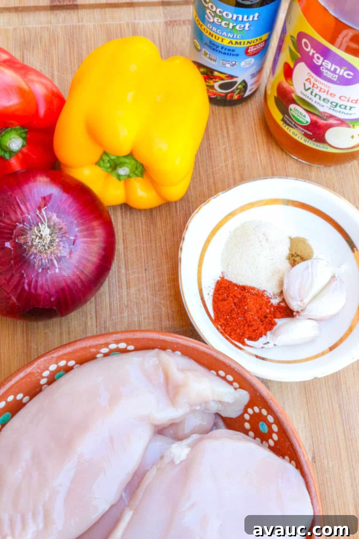 Sizzling Skillet Chicken Fajitas 3 bell peppers, red onion, coconut aminos, apple cider vinegar, spices in a small bowl, chicken breasts