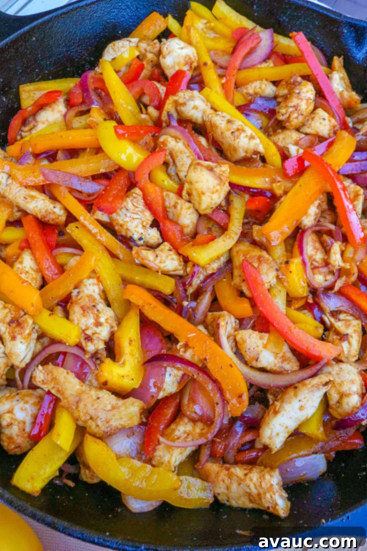 Sizzling Skillet Chicken Fajitas 6 chicken fajitas with bell peppers in a cast iron