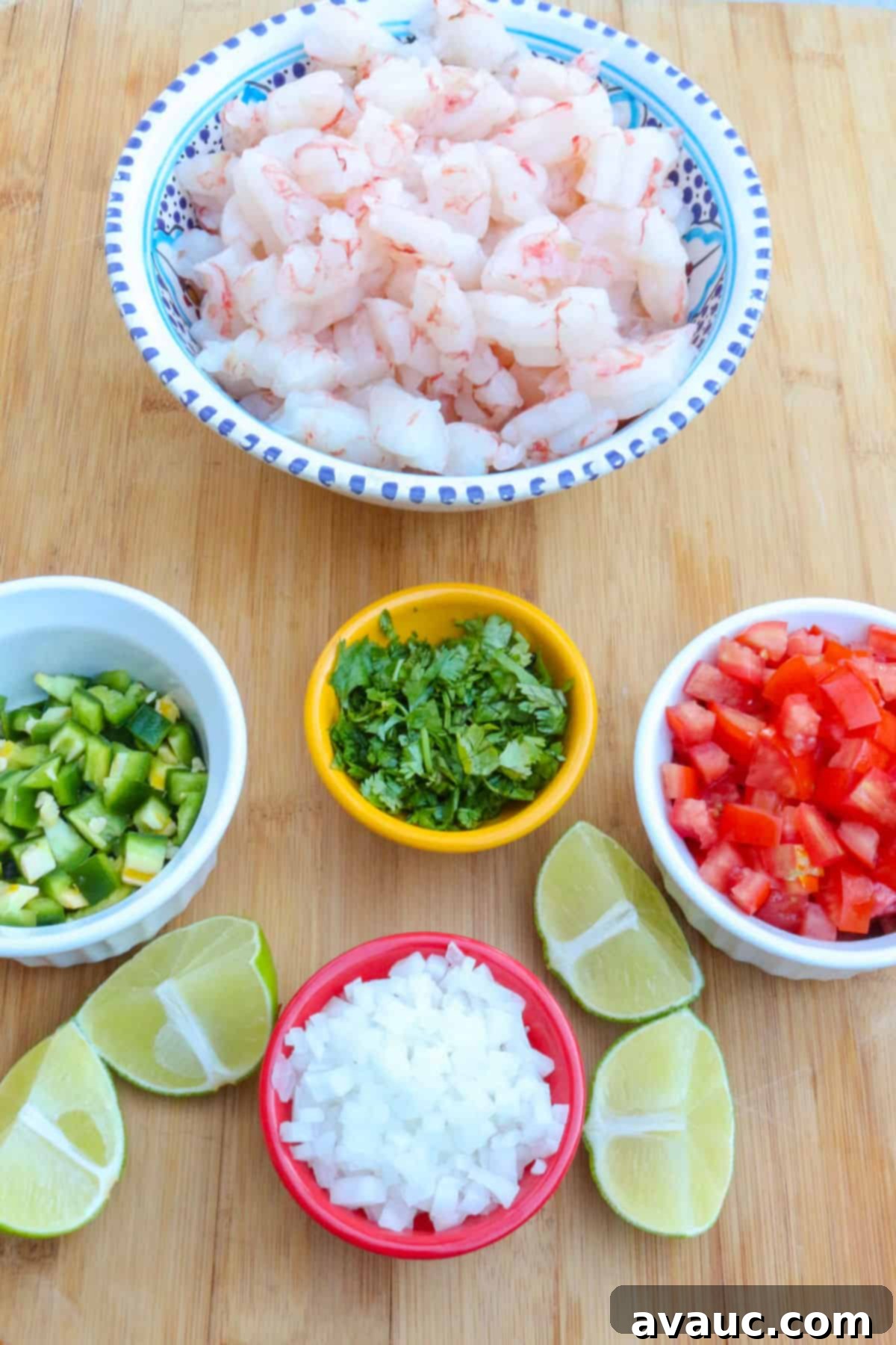 Zesty Mexican Shrimp Ceviche 3 A bowl with shrimp, another with diced jalapeño, diced cilantro, diced tomato, diced onion, and some cut limes