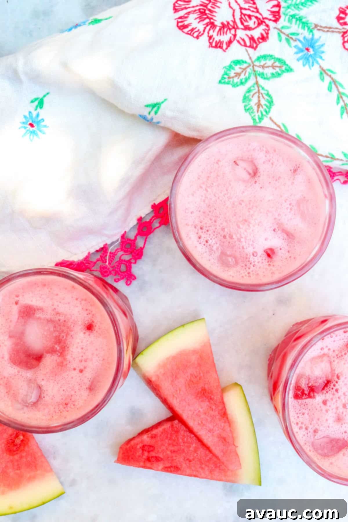 Three glasses filled with Agua de Sandia, ready to serve