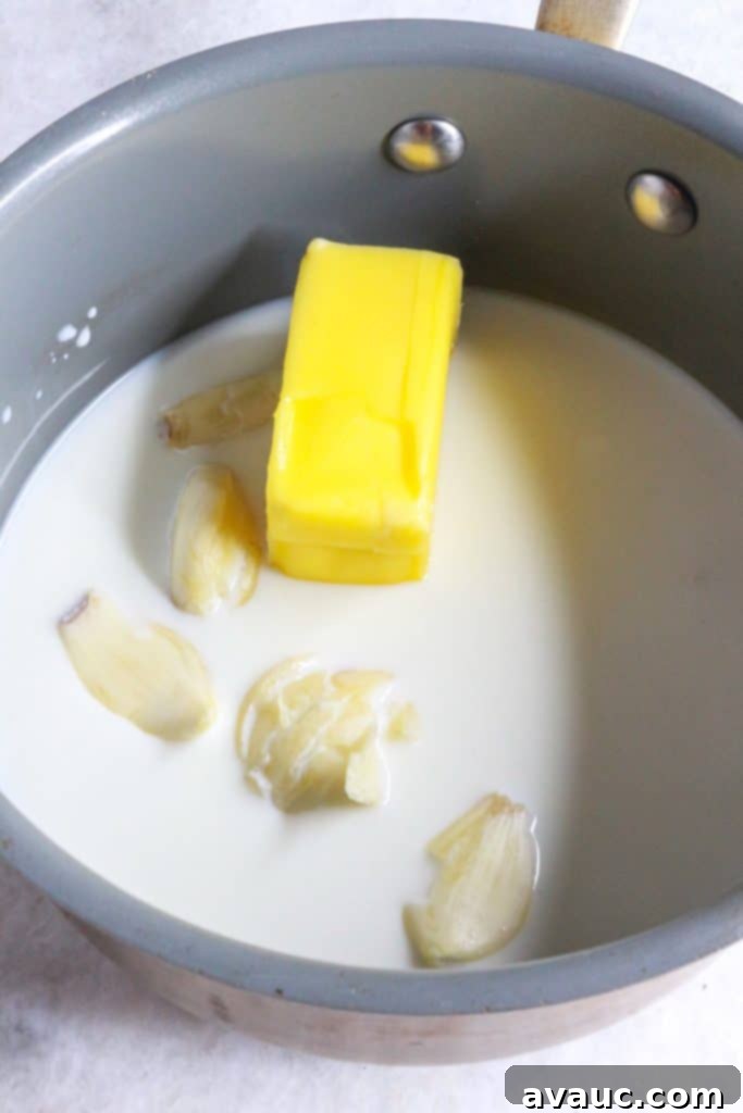 Creamy Instant Pot Garlic Mash 6 Piece of butter, smashed garlic cloves in milk