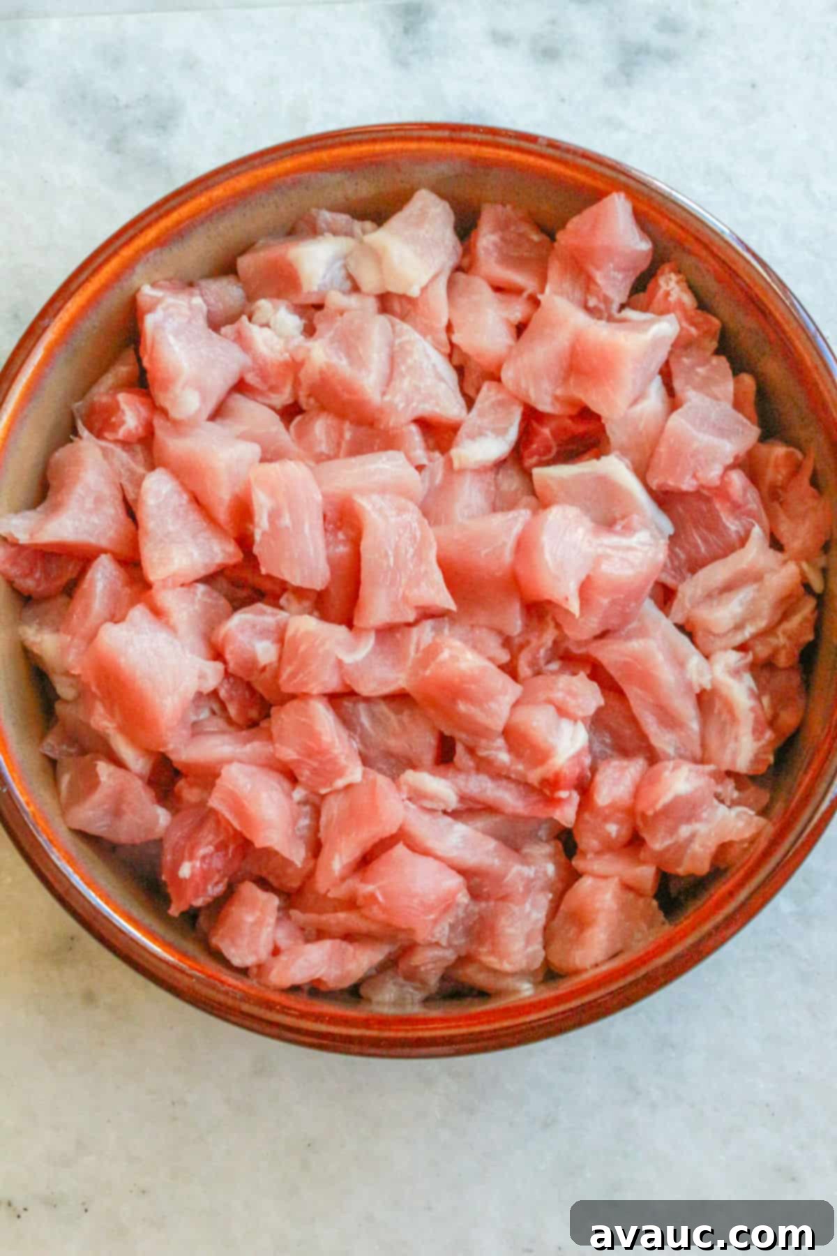 Hearty White Pozole 5 Diced pork in a large bowl