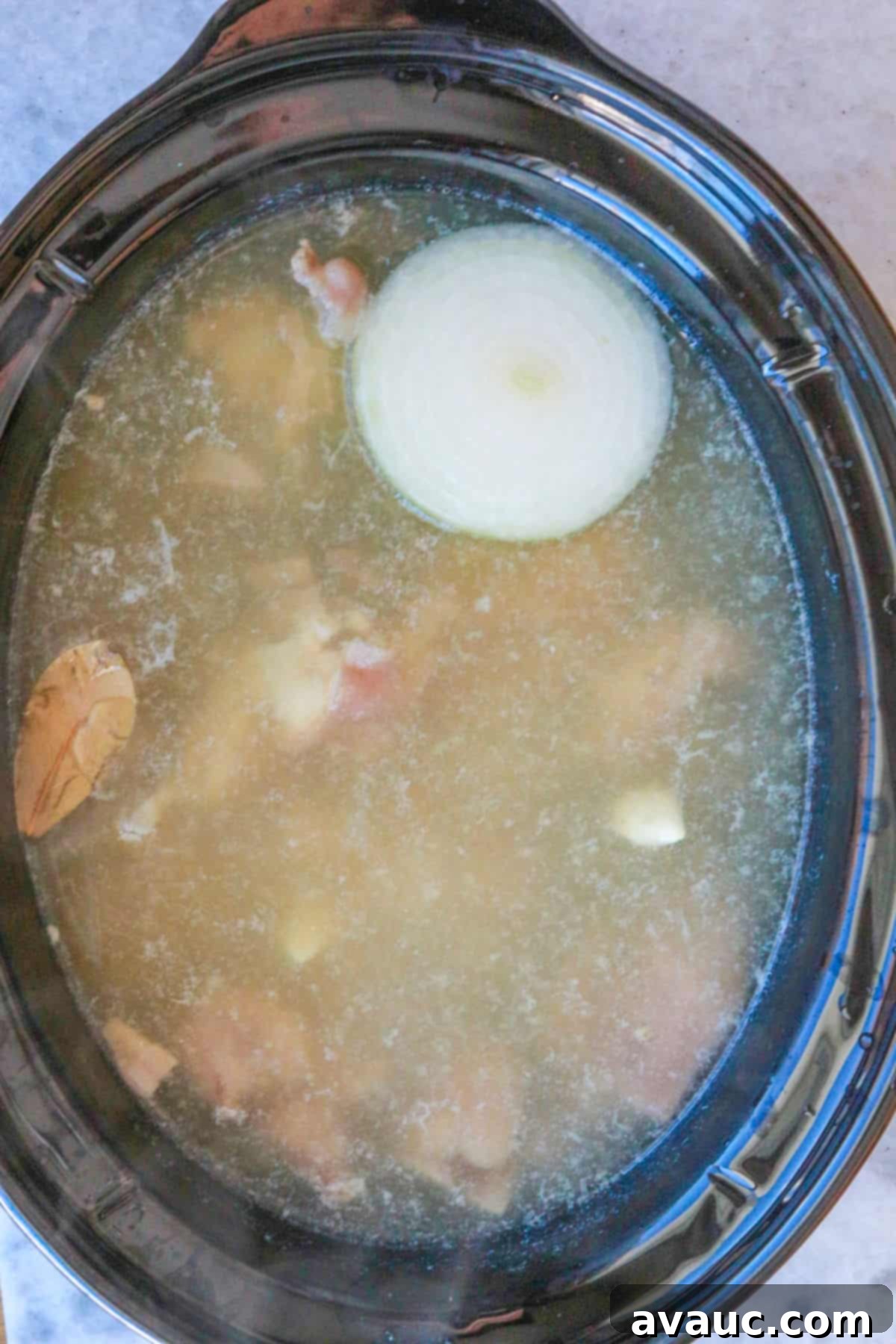 Hearty White Pozole 7 White pozole cooking in slow cooker