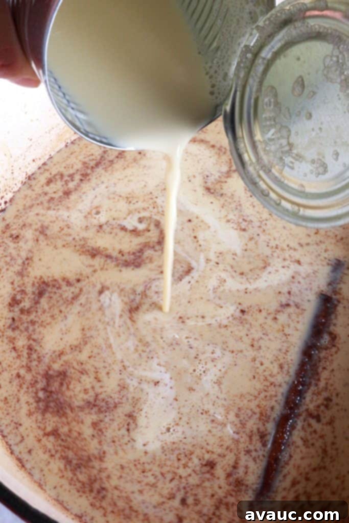 Authentic Mexican Champurrado 6 Adding evaporated milk to champurrado