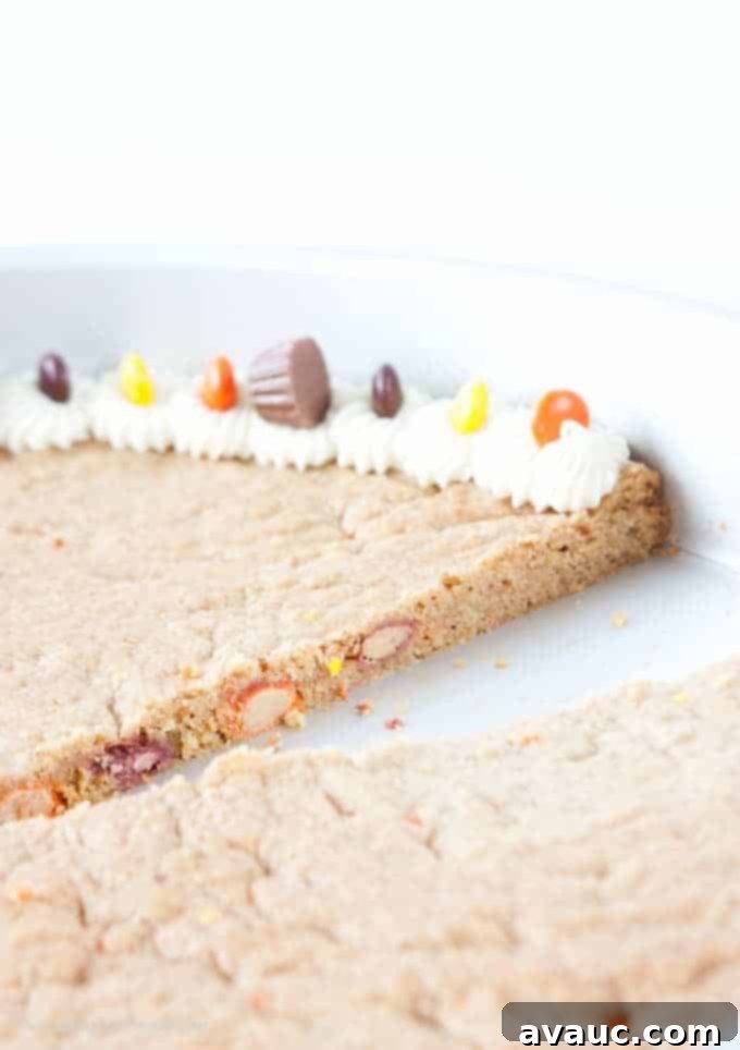 Forget the store bought! This Reeses Peanut Butter Cookie Cake is easy to whip up and just as tasty as its premade competition! Recipe by Design Eat Repeat