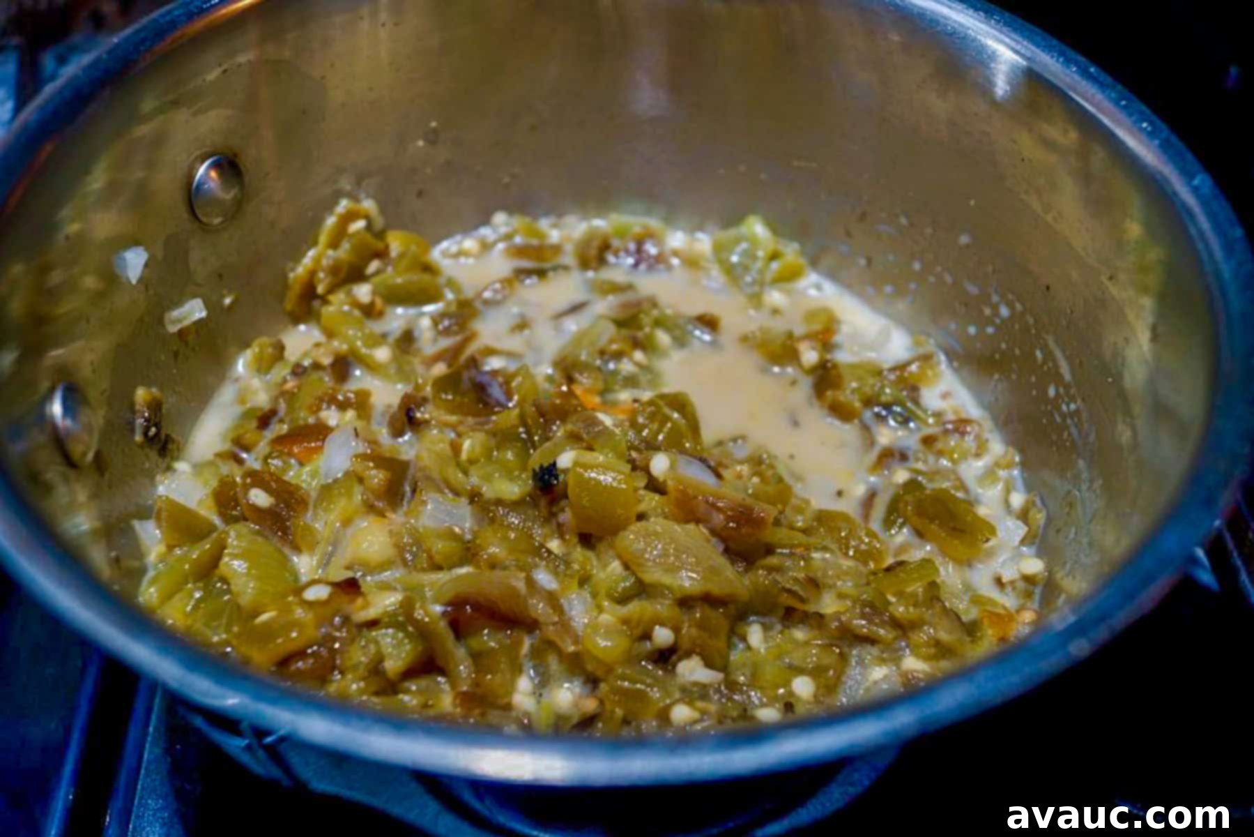 Zesty Green Chile and Melted Cheese 8 Green chiles and milk in a pot