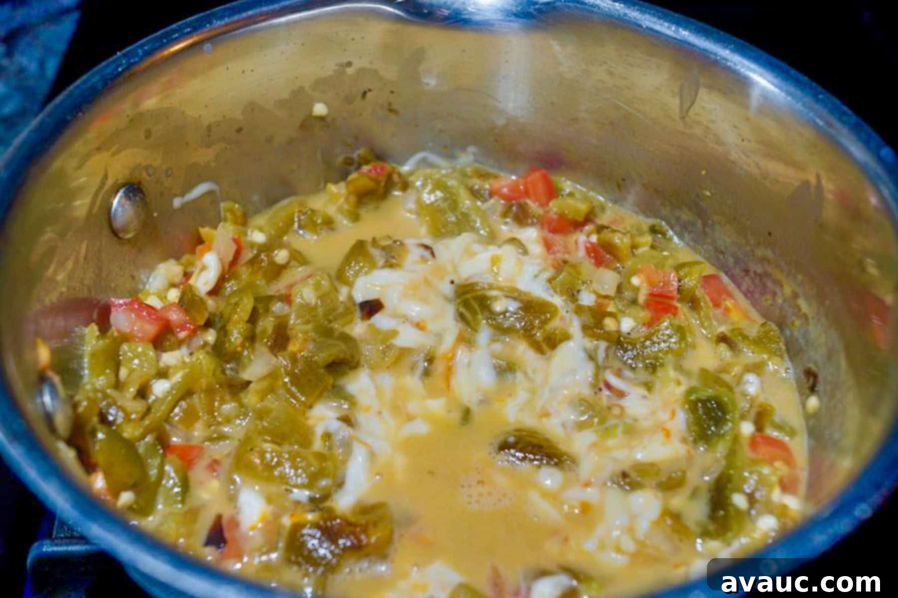 Zesty Green Chile and Melted Cheese 9 Chile con queso simmering in a small pot