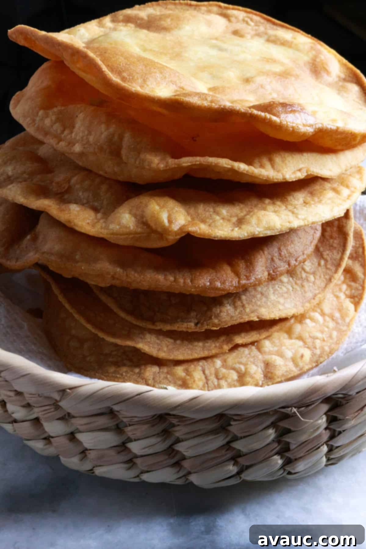 Homemade Tostada Shells Made Easy 2 Stacked homemade tostada shells, golden and crispy, ready to be topped