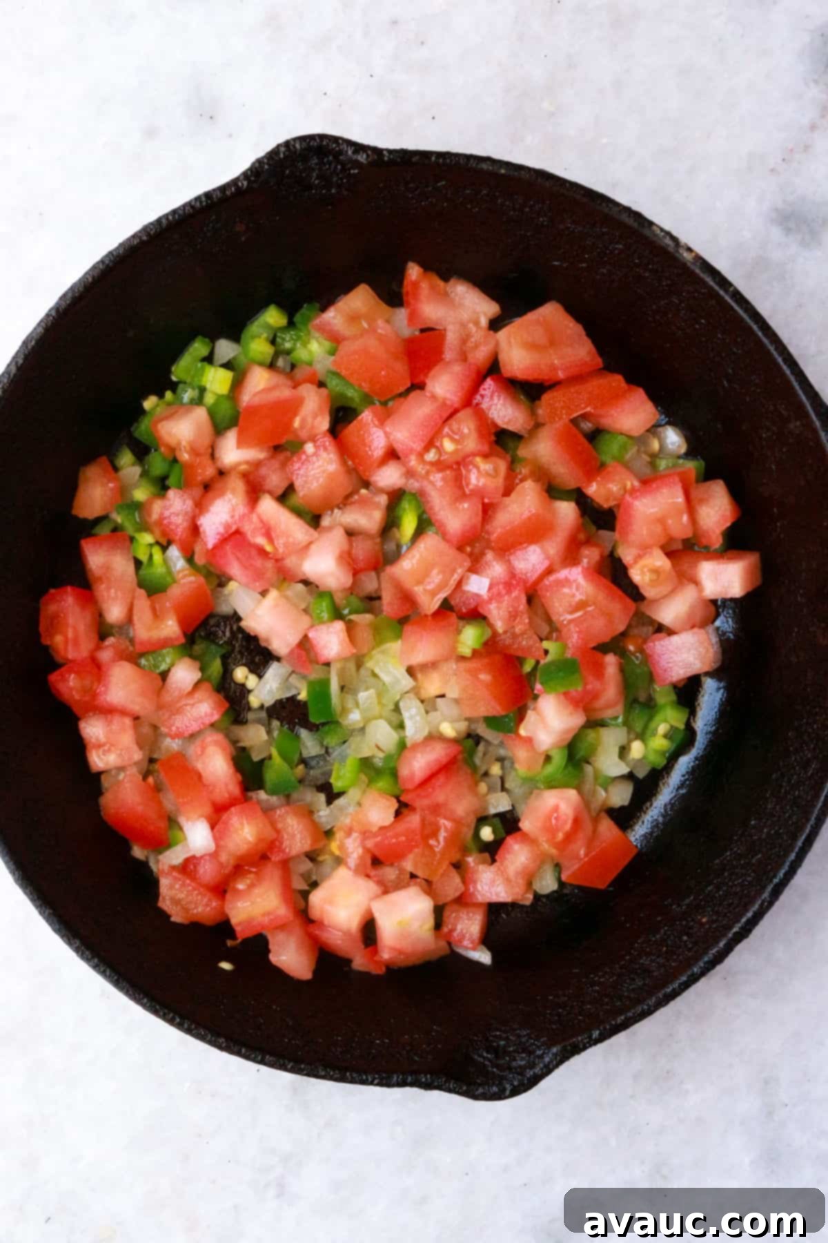 Mexican Scrambled Eggs 5 Sautéed serranos, onions and tomatoes in a cast-iron skillet